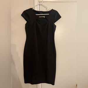 Black dress worn peep hole neck line/gold chain